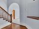Entryway with hardwood floors, staircase, and built-in shelf at 32 Peeksville Rd, Locust Grove, GA 30248