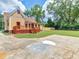 Yellow house with a large deck and spacious yard at 32 Peeksville Rd, Locust Grove, GA 30248
