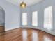 Living room with hardwood floors and arched hallway at 32 Peeksville Rd, Locust Grove, GA 30248