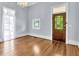 Living room with hardwood floors, stained glass door and window at 32 Peeksville Rd, Locust Grove, GA 30248