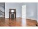 Living room with hardwood floors and ornate fireplace at 32 Peeksville Rd, Locust Grove, GA 30248