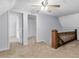 Upstairs hall with carpet, doors to bedrooms, and wooden staircase railing at 32 Peeksville Rd, Locust Grove, GA 30248