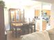 Bright dining room features a table with six chairs and a china cabinet at 6390 Arbor Ln, Morrow, GA 30260