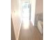 Bright entryway with wood-look flooring leading to the living room at 6390 Arbor Ln, Morrow, GA 30260