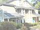 Two story home with gray siding and landscaping at 6390 Arbor Ln, Morrow, GA 30260