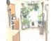 Kitchen boasts wood cabinets, tile floor and an abundance of plants at 6390 Arbor Ln, Morrow, GA 30260