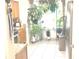 Kitchen boasts wood cabinets, tile floor and an abundance of plants at 6390 Arbor Ln, Morrow, GA 30260