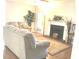 Spacious living room with a fireplace, hardwood floors, and lots of natural light at 6390 Arbor Ln, Morrow, GA 30260
