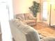 Living room featuring a neutral couch, fireplace, and hardwood floors at 6390 Arbor Ln, Morrow, GA 30260