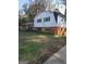 Ranch style home with green shutters and a large yard at 1521 Green Valley Ct, Conley, GA 30288