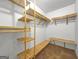Large walk-in closet with ample shelving and hanging space at 2021 Brook Valley Ct, Jonesboro, GA 30236