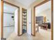 Home features a long hallway with closet and views to living room at 2021 Brook Valley Ct, Jonesboro, GA 30236