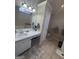 Main bathroom featuring dual vanity sinks and distressed cabinets at 116 Winthrop Dr, Sharpsburg, GA 30277