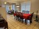 Dining area with a table, chairs, and a view of the sunroom at 116 Winthrop Dr, Sharpsburg, GA 30277
