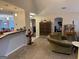 Living room with vaulted ceilings, carpeted floors, and a view of the kitchen at 116 Winthrop Dr, Sharpsburg, GA 30277