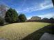 Spacious backyard with grassy lawn and trees at 1529 Evergreen Hollow Ln, Conyers, GA 30012