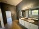 Double vanity bathroom with a view of garden tub at 1529 Evergreen Hollow Ln, Conyers, GA 30012