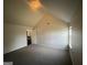 Spacious bedroom with vaulted ceiling and carpet at 1529 Evergreen Hollow Ln, Conyers, GA 30012