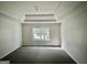 Spacious bedroom with carpeted floor and large window at 1529 Evergreen Hollow Ln, Conyers, GA 30012