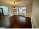 Formal dining room with hardwood floors, chandelier, and wainscoting at 1529 Evergreen Hollow Ln, Conyers, GA 30012