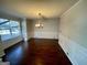 Formal dining room with hardwood floors and wainscoting at 1529 Evergreen Hollow Ln, Conyers, GA 30012