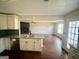 Open concept kitchen with granite island and view of living room at 1529 Evergreen Hollow Ln, Conyers, GA 30012