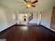 Bright living room with hardwood floors and a view of the staircase at 1529 Evergreen Hollow Ln, Conyers, GA 30012