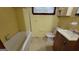 Clean bathroom with a bathtub, toilet and vanity at 6216 Twilight Trl, Morrow, GA 30260