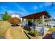 Pergola with seating area and string lights at 1285 E Hwy 5, Carrollton, GA 30116