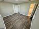 Bedroom with wood-look floors and access to bathroom at 219 Decatur Rd, Mcdonough, GA 30253