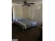 Bedroom with a full-size bed and ceiling fan at 8965 Campbellton St, Douglasville, GA 30134