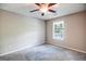 Bright bedroom with ceiling fan and carpeting at 903 Olde Mill Ln, Norcross, GA 30093