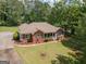 Ranch style brick house with a spacious yard and trees at 611 Bernhard Rd, Fayetteville, GA 30215