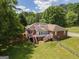 House's back features a deck, stairs, and fenced yard at 611 Bernhard Rd, Fayetteville, GA 30215