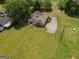 Back of house with large yard, deck, and long driveway at 611 Bernhard Rd, Fayetteville, GA 30215