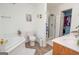 Bathroom features a soaking tub, shower, and updated vanity at 611 Bernhard Rd, Fayetteville, GA 30215