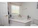 Bathroom with corner soaking tub and updated fixtures at 611 Bernhard Rd, Fayetteville, GA 30215