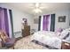 Bedroom with ceiling fan, dresser, and full bed at 611 Bernhard Rd, Fayetteville, GA 30215