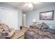 Comfortable bedroom with a large closet and sitting area at 611 Bernhard Rd, Fayetteville, GA 30215