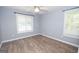 Simple bedroom with ceiling fan and wood-look floors at 611 Bernhard Rd, Fayetteville, GA 30215