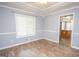 Bright dining room with hardwood floors and view to kitchen at 611 Bernhard Rd, Fayetteville, GA 30215