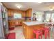 Kitchen with island, oak cabinets and granite countertops at 611 Bernhard Rd, Fayetteville, GA 30215