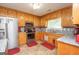 Kitchen with oak cabinets, granite counters, and stainless steel appliances at 611 Bernhard Rd, Fayetteville, GA 30215