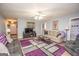 Spacious living room with hardwood floors, fireplace and large windows at 611 Bernhard Rd, Fayetteville, GA 30215