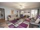 Spacious living room with hardwood floors, fireplace, and large windows at 611 Bernhard Rd, Fayetteville, GA 30215