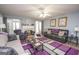 Spacious living room with hardwood floors, fireplace and large windows at 611 Bernhard Rd, Fayetteville, GA 30215