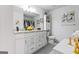 Main bathroom with double vanity and granite countertops at 122 Delilah St, Mcdonough, GA 30252