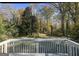 Private backyard with green grass and mature trees at 2658 Rollingwood Se Ln, Atlanta, GA 30316