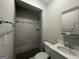 Updated bathroom with gray tile shower and white vanity at 2658 Rollingwood Se Ln, Atlanta, GA 30316