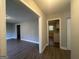 Bright hallway with hardwood floors, leading to kitchen and living areas at 2658 Rollingwood Se Ln, Atlanta, GA 30316